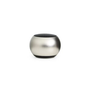 Caixa de Som Bluetooth TWS sobre uma mesa de escritório moderna.